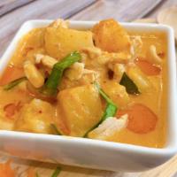 Pineapple Curry · Red curry paste with coconut milk, bell peppers, pineapple and Thai Basil.