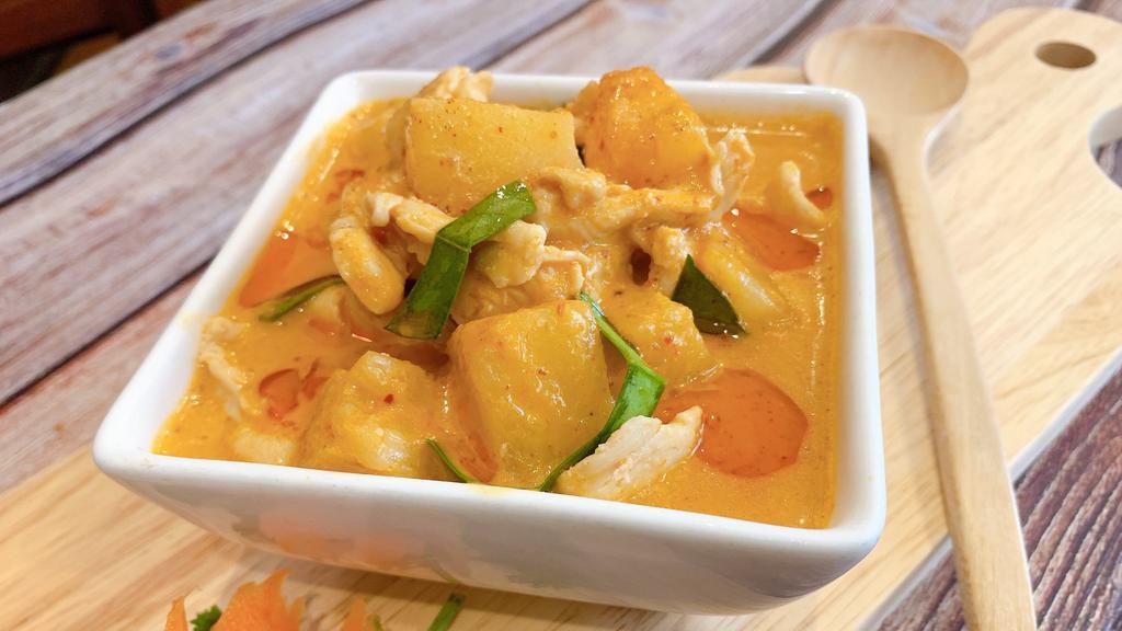 Pineapple Curry · Red curry paste with coconut milk, bell peppers, pineapple and Thai Basil.