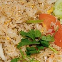 Thai Fried Rice · Stir-fried jasmine rice with egg, tomato, onion, carrot, snow peas. Topped with cilantro.