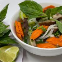 Steamed Vegetables, Fried Tofu & Mushroom Noodle Soup · Vegan Broth. Gluten-Free & Vegan. Served with a side of bean sprouts, basil, cilantro, jalap...