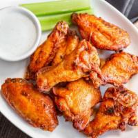 Wings · Bone-in tossed in your choice of sauce from honey glazed BBQ, fire, sweet chipotle, pineappl...