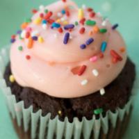 Chocolate Sprinkles Babycake (Cupcake) · Chocolate cake w/ pink cream cheese frosting & rainbow sprinkles *contains soy
