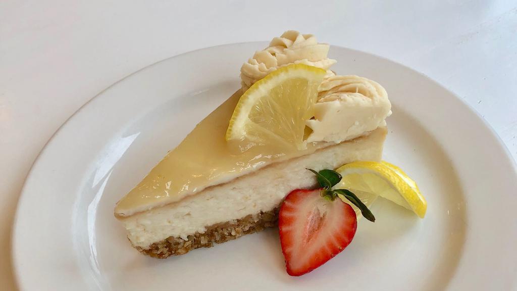 Slice Of Lemon Cheesecake · Lemon cheesecake w/ graham cracker crust & topped with lemon curd *contains coconut & soy