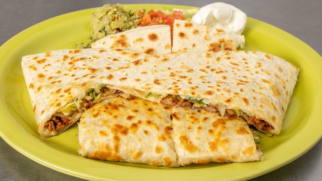 Quesadillas · Flour tortilla filled with your meat choice or just cheese. Served with sour cream and guacamole.