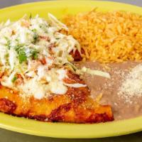 Enchilada Regulares · two corn tortillas filled with your meat choice covered in red salsa. Served with rice and b...