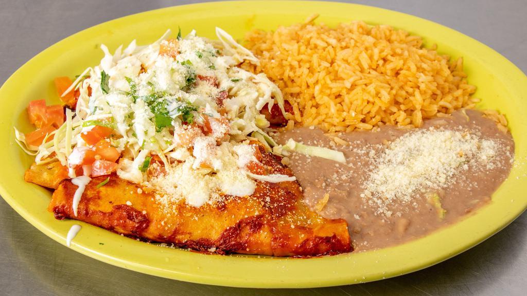 Enchilada Regulares · two corn tortillas filled with your meat choice covered in red salsa. Served with rice and beans.