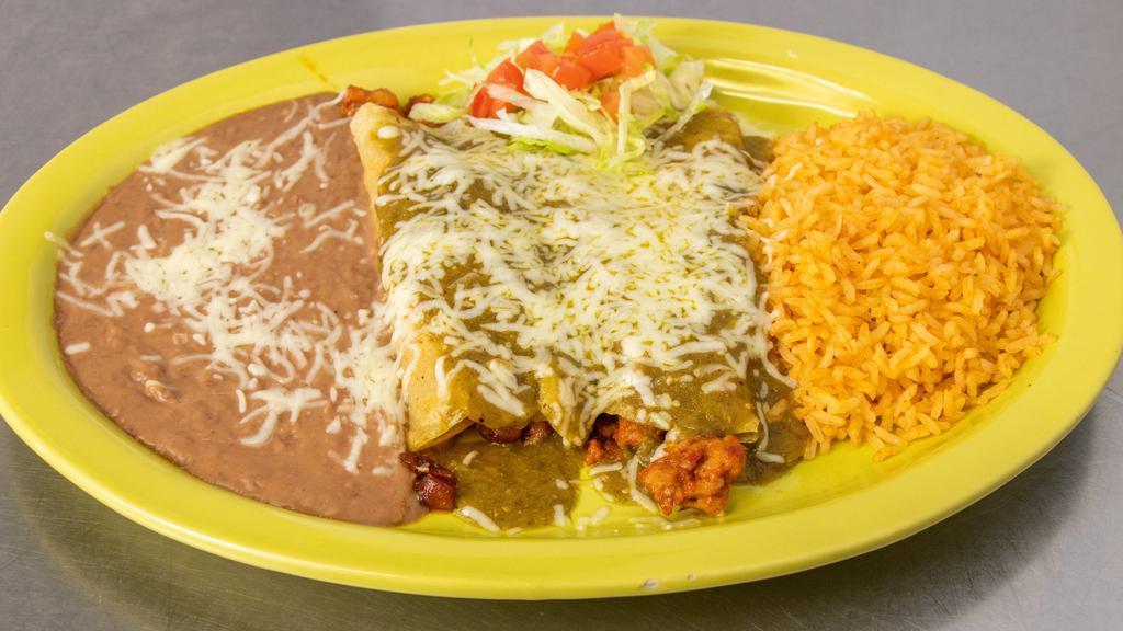 Enchilada Verdes · two corn tortillas filled with your choice of meat, covered in a non-spicy green salsa and topped with cheese. Served with rice and beans.