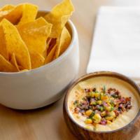 Queso Fundido · Muenster & Jack Cheeses, Peanut Salsa Macha, Pepitas, Queso Fresco, Tortilla Chips