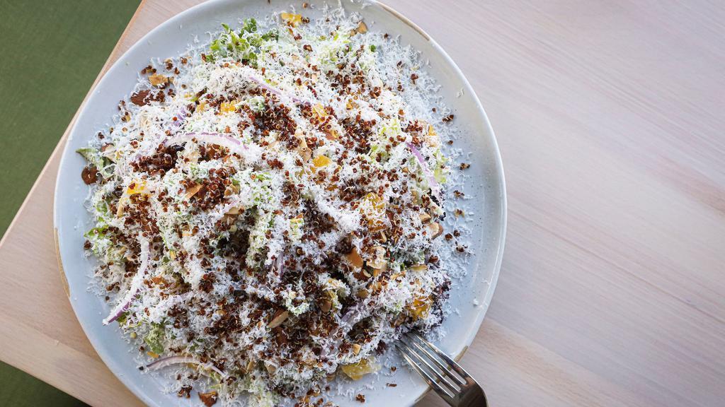 Brussels Sprouts Salad · Spicy Goddess Dressing, Quinoa, Almond, Cotija Cheese, Dried Canteloupe.