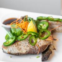 Hamachi-Kama · Grilled yellow-tail collar served over mixed greens with a teriyaki or ponzu sauce and a sal...