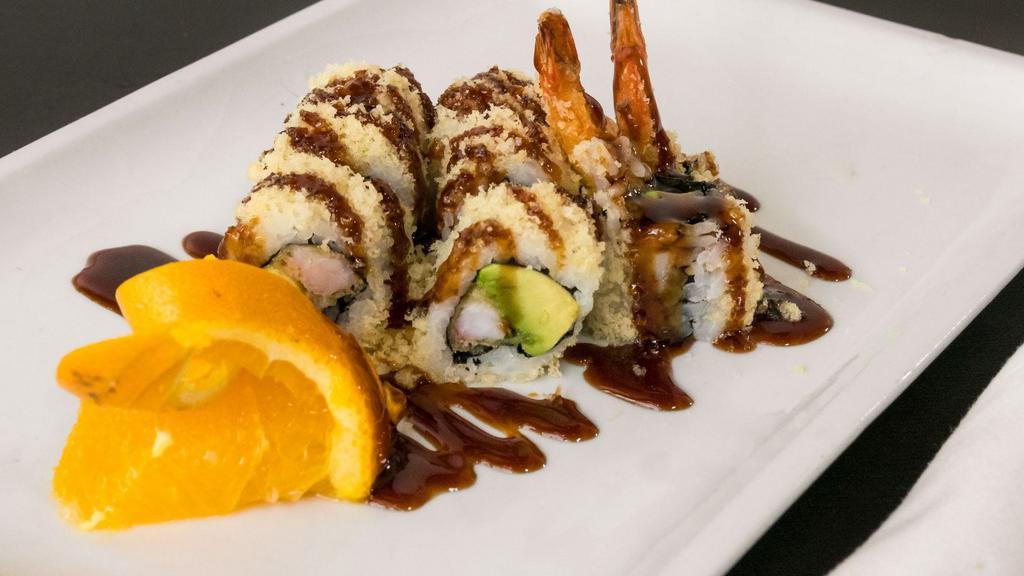 Crunchy Roll · Shrimp tempura, avocado and aioli rolled in crunchy tempura flakes and topped with unagi sauce.