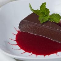 Chocolate Decadence · Guittard chocolate, Monarch rum, whipped cream topped with raspberry sauce.