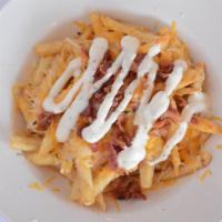 Bacon Cheese Fries (Half Pounder) · Regular fries, Cheddar/Jack cheese, applewood smoked bacon, drizzled with ranch.