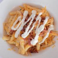 Bacon Cheese Fries (One Pounder) · Regular fries, Cheddar/Jack cheese, applewood smoked bacon, drizzled with ranch.