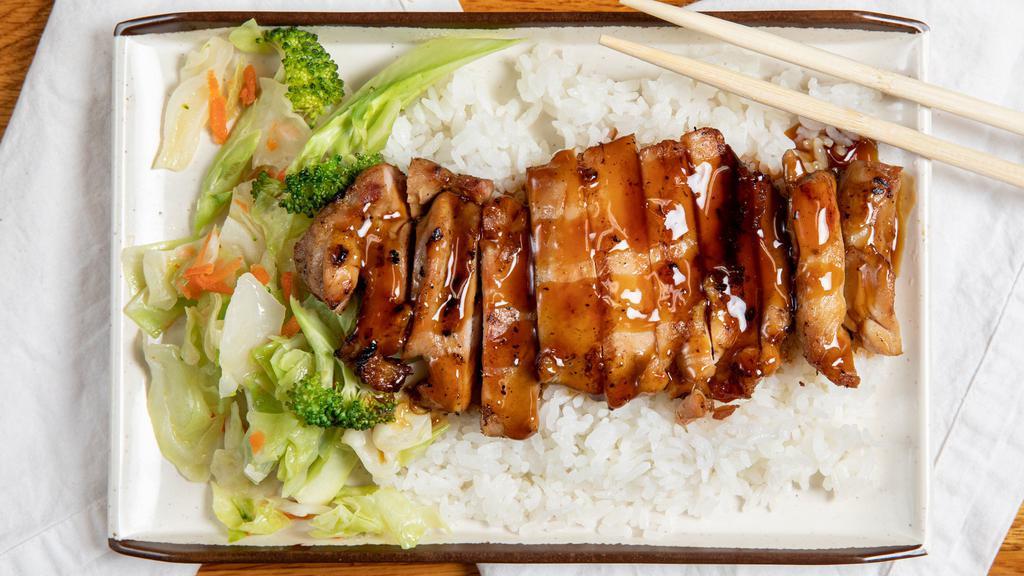 Chicken Bento · Sliced chicken with veggle over steamed rice.