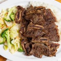 Beef Short Rib · Sliced beef short rib with veggie over steamed rice.