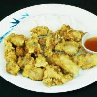 Sweet & Sour Chicken · Deep fried chicken served with sweet and sour sauce over rice.