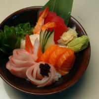 Chirashi Bowl · 17 pieces of assorted sashimi, tamago, and seaweed salad on top of sushi rice.