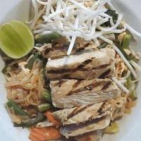 Pad Thai Lemongrass Chicken · grilled lemongrass chicken breast, with vegetable pad Thai topped with peanut sauce.