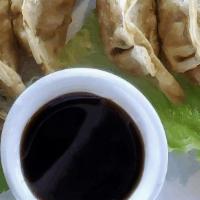 Pot Sticker · Fried pork and cabbage dumpling. Served with ginger soy dipping sauce.