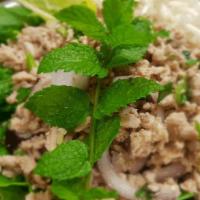 Larb · Ground chicken, red onion, green onion, rice powder and cilantro in lime dressing