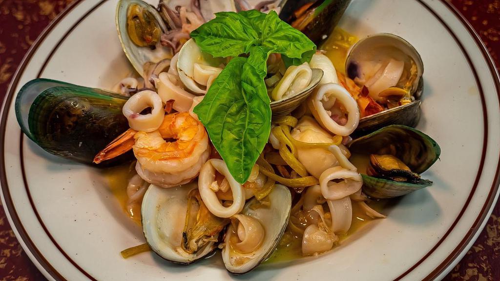 Frutti Del Pescatore · Shrimp, scallops, squid, clams, and mussels, sautéed in EVOO, garlic and wine, then tossed with a roasted tomato seafood sauce.