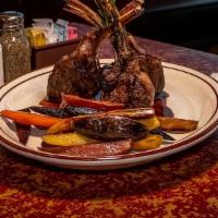 Lamb Chops Berlusconi · Char broil lamb chops, served with fingerling potatoes, baby rainbow carrots, and a Madeira ...