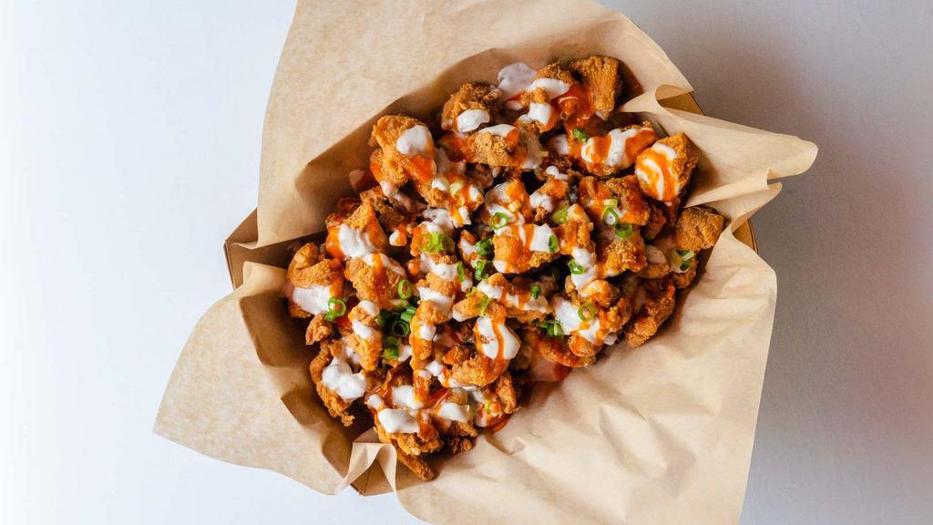 Popcorn Chicken · Our popcorn chicken is made with thigh meat and we bring it like all our chicken. What does that mean? More flavor!