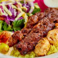 Mixed Grill · A mix of grilled chicken, beef kabab, and adana kebab, served with rice, salad, hummus and p...