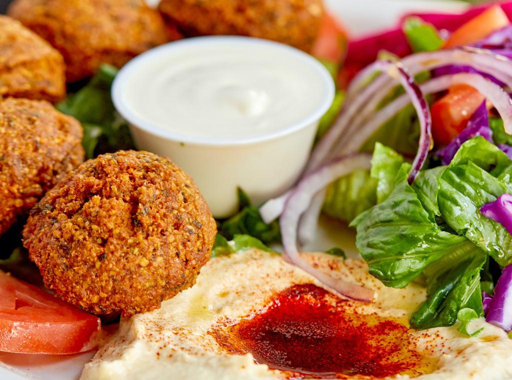 Falafel Plate · 5 pieces of falafel served with salad, hummus and pita bread.