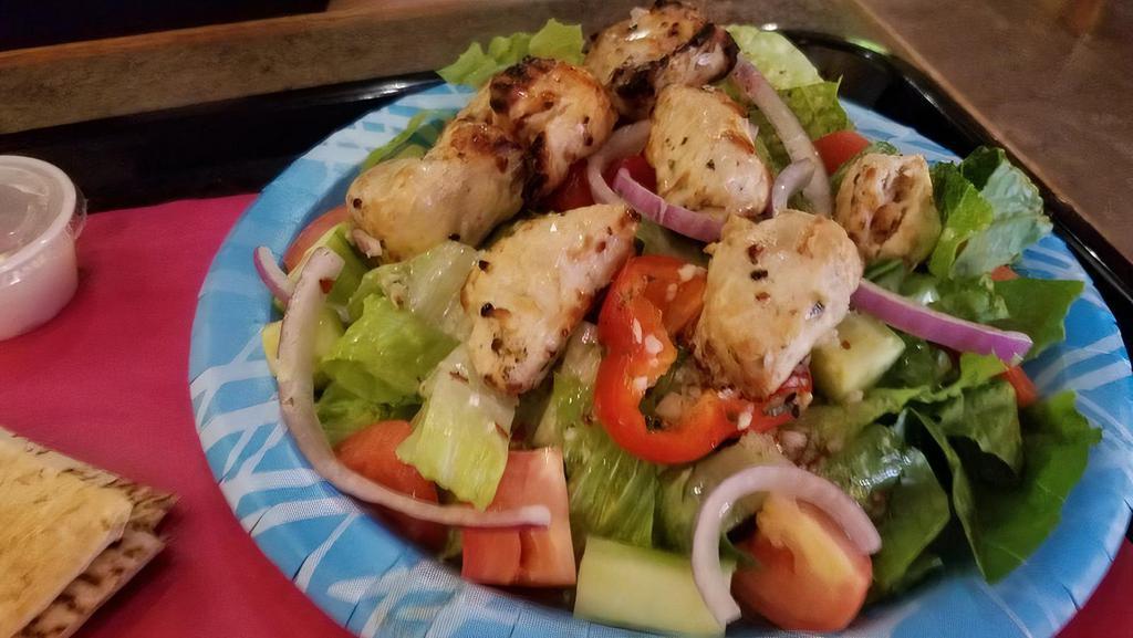 Chicken Salad · 2 skewers of grilled chicken served on lettuce, tomato, cucumber, red onion, bell pepper, lemon juice, olive oil, and garlic.