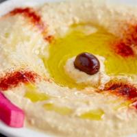 Hummus · Garbanzo beans, garlic, fresh lemon, paste and pita bread.