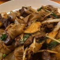 Beef Chow Fun · Wide rice noodle quickly stir fried over a high flame with beef, bean sprouts and onion with...