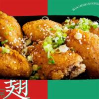 Sichuan Honey Wings (6Pc) · Crispy wings coated with sweet and savory sauce with a spicy kick. Aka House Wings.