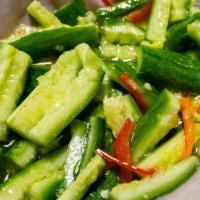 Cucumber Salad · Crunchy smashed cucumber in garlic and vinegar sauce. Vegan Optional