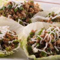 Chicken Lettuce Wrap · Minced chicken with mushroom, water chestnuts and green onions in a house stir fry served wi...