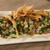 Ceviche · 8 oz fillet cut fresh red snapper topped with cucumber, tomatoes, serrano peppers, cilantro ...