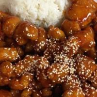 Sesame Chicken · White meat chicken battered and deep fried, cooked in a wok in sweet sauce.