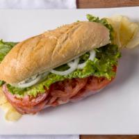 Italian Sub Sandwich · Salami, capicola, smoked ham, provolone cheese, lettuce, tomato, onion, oil, vinegar, herbs ...
