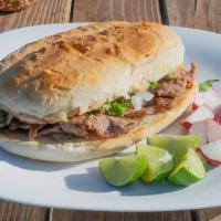 Lengua Torta · Homemade Mexican sandwich prepared with toasted Telera Bread grilled with butter, and topped...