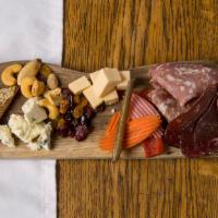 Charcuterie · Cured meats, local cheeses, pickled vegetables, spiced nuts, grilled sourdough.