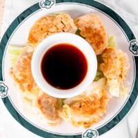 Pot Sticker (6 Pcs) · Pan fried Chinese dumpling with groud pork and veg. This item is very popular in mainland Ch...