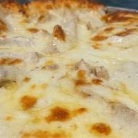 White Pizza · Alfredo sauce in place of pizza sauce and chicken.
