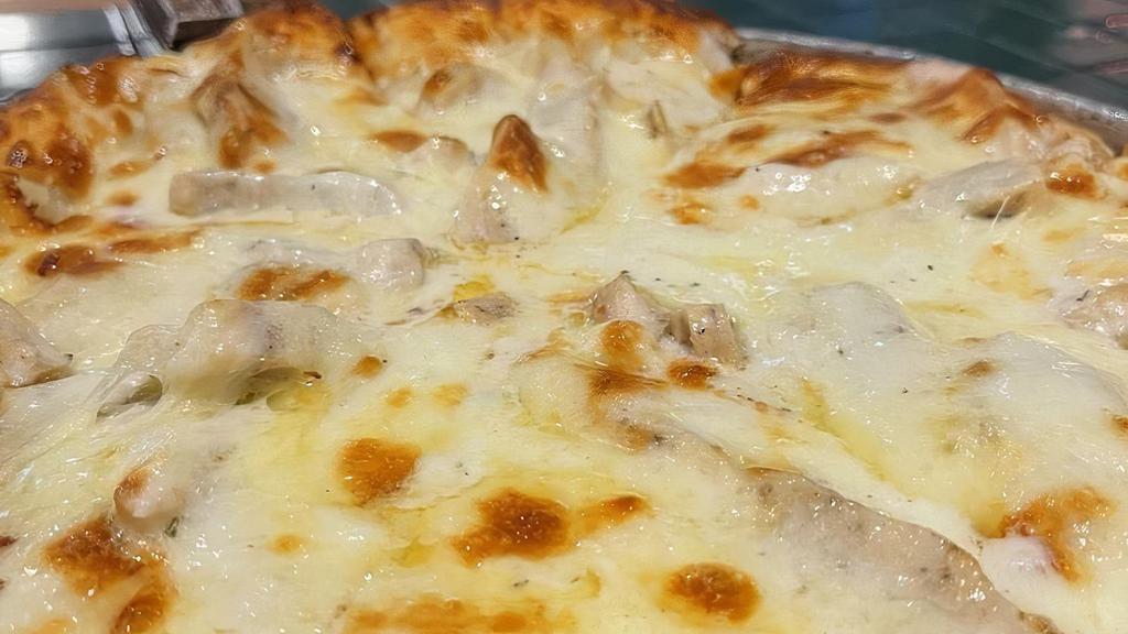 White Pizza · Alfredo sauce in place of pizza sauce and chicken.