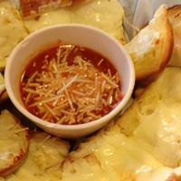 Garlic Bread Strips · Strips of garlic bread with melted provolone cheese. Served with marinara sauce.