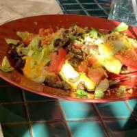 Nachos · Crisp corn chips, taco meat, nacho cheese, lettuce, tomatoes, green onion, and black olives....