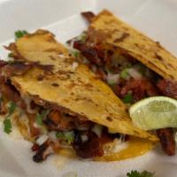 Quesa Pastor · Crispy taco with cheese, pineapple, onion and cilantro