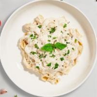 Chicken Fettuccine · Fresh fettuccine pasta served with a creamy alfredo sauce and chicken.