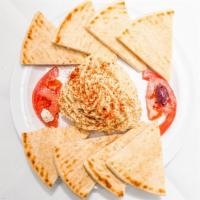 Hummus Plate · A blend of ground chickpeas mixed with tahini, olive oil, and spices, served as a cold dip w...