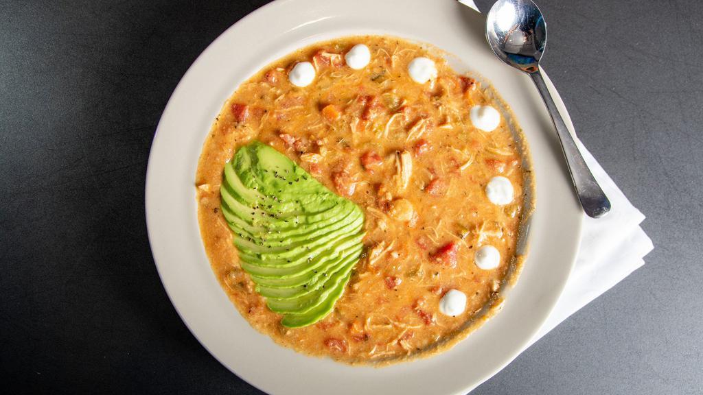Chicken Tortilla Soup · Chef B's family recipe topped with fresh avocado and sour cream.